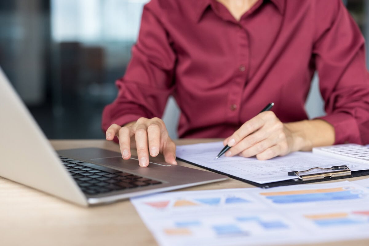 small business tax accountant reviewing financial reports