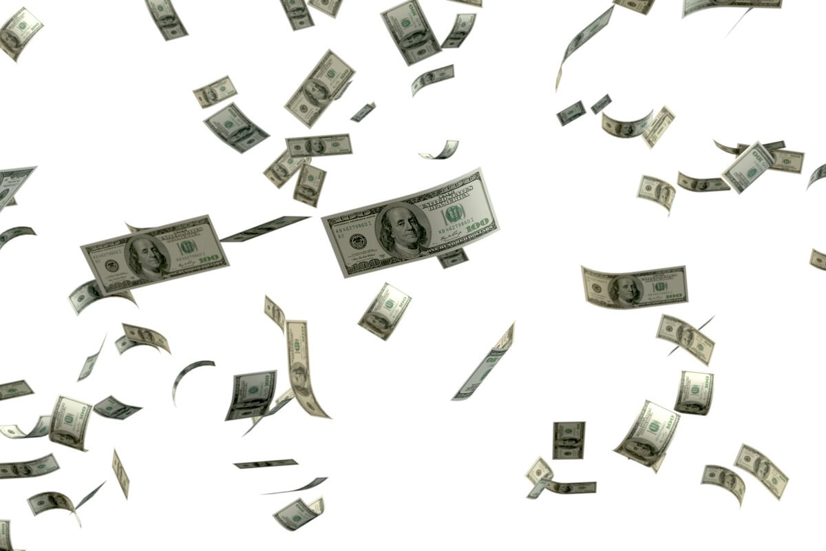 Falling hundred dollar bills illustrating US Debt and New Taxes