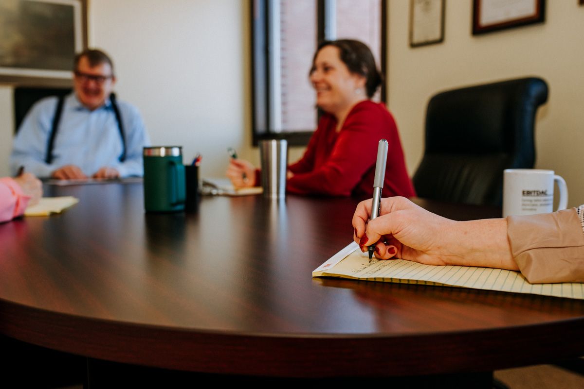 accounting team discussing tax prep documents