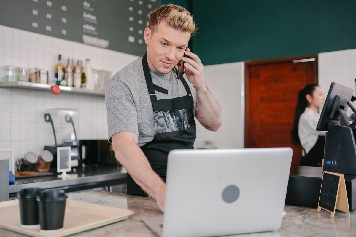 small business owner reviewing tax documents on laptop
